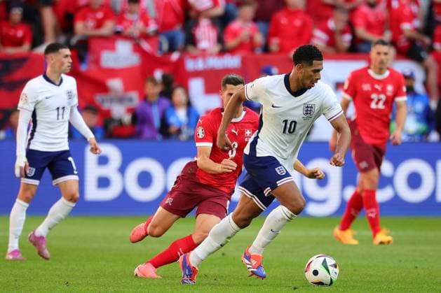 Jude Bellingham of England and Remo Freuler of Switzerland compete for the ball during the Euro 2024 Quarter-finals football match between England and Switzerland at Dusseldorf Arena Stadium in Dusseldorf (Germany), July 6th, 2024. cesarexpurini