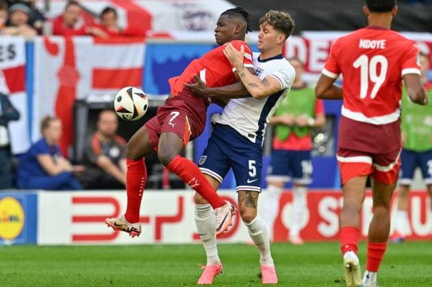 240706 EURO2024 ENGLAND VS SWITZERLAND John Stones (5) of England lifts Breel Embolo (7) of Switzerland during a soccer game between the national teams of England and Switzerland in a Quarter Final knock out game of the UEFA EURO, EM, Europameisterschaft,Fussball 2024 tournament , on Saturday 6 July 2024 in Dusseldorf , Germany . photo sportpix David Catry Dusseldorf GERMANY  Copyright: xx 472817