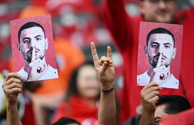 Germany Soccer Euro 2024 Netherlands - Turkey 8723940 06.07.2024 Turkey s fans make a wolf salute and hold portraits of Turkey s soccer player Merih Demiral disqualified by UEFA for two matches for making a wolf salute during a match against Austria, before the UEFA EURO, EM, Europameisterschaft,Fussball 2024 quarter final soccer match between Netherlands and Turkey at the Olympiastadion in Berlin, Germany. Alexey Filippov Sputnik Berlin Germany  Copyright: xAlexeyxFilippovx