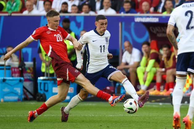 Michel Aebischer Switzerland, 20 and Phil Foden England, 11 , Football, UEFA , European Championship, Quarterfinals 2024, England vs Switzerland, 06 07 2024, Duesseldorf Arena, Duesseldorf, Germany Duesseldorf Duesseldorf Arena Nordrhein Westfalen Germany Copyright: xGrantxHubbsx