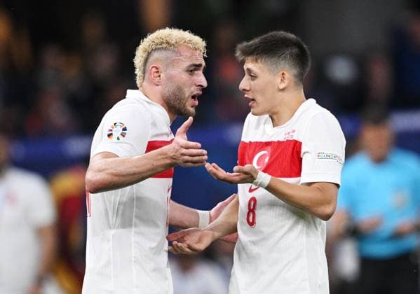 Germany Soccer Euro 2024 Netherlands - Turkey 8724089 06.07.2024 Turkey s Baris Alper Yilmaz, left, and Turkey s Arda Guler talk during the UEFA EURO, EM, Europameisterschaft,Fussball 2024 quarter final soccer match between Netherlands and Turkey at the Olympiastadion in Berlin, Germany. Alexey Filippov Sputnik Berlin Germany  Copyright: xAlexeyxFilippovx