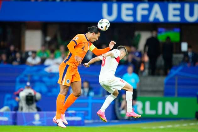 Netherlands v Türkiye: Quarter-Final - UEFA EURO, EM, Europameisterschaft,Fussball 2024 Virgil van Dijk Centre-Back of Netherland and Liverpool FC and Arda Guler attacking midfield of Turkey and Real Madrid compete for the ball during the UEFA EURO 2024 quarter-final match between Netherlands and Türkiye at Olympiastadion on July 6, 2024 in Berlin, Germany. Berlin Germany  Copyright: xJosexBretonx originalFilename:bretonhernandez-netherla240706_npWCR.jpg