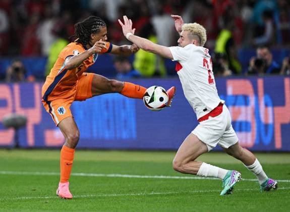 Germany Soccer Euro 2024 Netherlands - Turkey 8724134 06.07.2024 Netherlands Nathan Ake,left, and Turkey s Baris Alper Yilmaz struggle for a ball during the UEFA EURO, EM, Europameisterschaft,Fussball 2024 quarter final soccer match between Netherlands and Turkey at the Olympiastadion in Berlin, Germany. Alexey Filippov Sputnik Berlin Germany  Copyright: xAlexeyxFilippovx