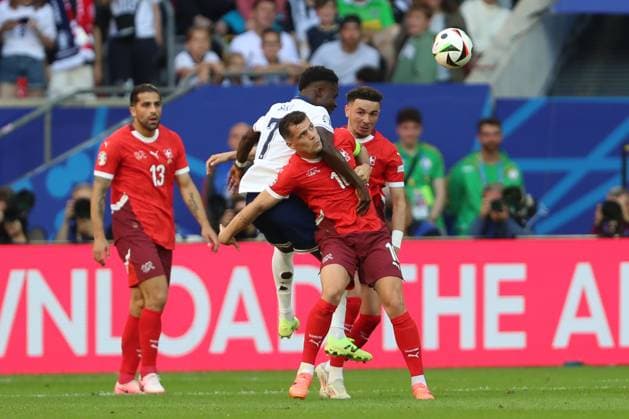 Bukayo Saka England and Granit Xhaka Switzerland in a duel, UEFA EURO 2024 Quarter final, England vs Switzerland, Arena Dusseldorf on July 06, 2024 in Dusseldorf, Germany Photo by Oliver Kaelke DeFodi Images Bukayo Saka England and Granit Xhaka Switzerland battle for the ball, UEFA EURO 2024 Quarter final, England vs Switzerland, Arena Dusseldorf on July 6, 2024 in Dusseldorf, Germany Photo by Oliver Kaelke DeFodi Images Defodi 678 2024 07 06 OK ENGSUI 1377 Defodi-678