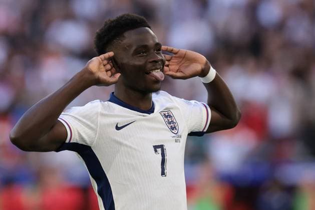 Dusseldorf, Germany, 6th July 2024. Bukayo Saka of England celebrates after successfully converting his spot kick in the penalty shoot out during the UEFA European Championships quarter final match at Dusseldorf Arena, Dusseldorf. Picture credit should read: Jonathan Moscrop Sportimage EDITORIAL USE ONLY. No use with unauthorised audio, video, data, fixture lists, club league logos or live services. Online in-match use limited to 120 images, no video emulation. No use in betting, games or single club league player publications. SPI-3220-0022