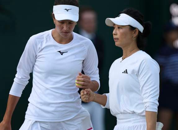 (240707) -- LONDON, July 7, 2024 -- Xu Yifan (R) Anna Danilina react during the women s doubles second round match between Xu Yifan (China) Anna Danilina (Kazakhstan) and Coco Gauff (United States) Jessica Pegula (United States) at Wimbledon tennis Championship in London, Britain on July 6, 2024. ) (SP)BRITAIN-LONDON-TENNIS-WIMBLEDON-WOMEN S DOUBLES HanxYan 