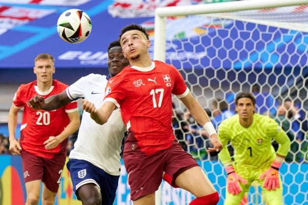 Bukayo Saka of England fights for a header with Ruben Vargas of Switzerland during the UEFA EURO, EM, Europameisterschaft,Fussball 2024 quarter finals match between England and Switzerland at Dusseldorf Arena on July 6, 2024 in Dusseldorf, Germany (Photo by Camilla Stolen Imago) Dusseldorf Germany Copyright: xCamillaxStolenx L2170252