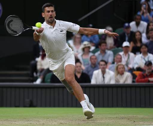 (240707) -- LONDON, July 7, 2024 -- Novak Djokovic hits a return the men s singles third round match between Novak Djokovic of Serbia and Alexei Popyrin of Australia at Wimbledon tennis Championship in London, Britain on July 6, 2024. ) (SP)BRITAIN-LONDON-TENNIS-WIMBLEDON HanxYan 