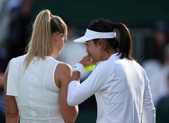 (240707) -- LONDON, July 7, 2024 -- Wang Yafan (R) Yana Sizikova communicate during the women s doubles first round match between Wang Yafan (China) Yana Sizikova (Russia) and Tamara Korpatsch (Germany) Bibiane Schoofs (the Netherlands) at Wimbledon tennis Championship in London, Britain on July 6, 2024. ) (SP)BRITAIN-LONDON-TENNIS-WIMBLEDON-WOMEN S DOUBLES HanxYan 