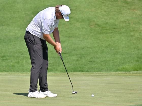 SILVIS, IL - JULY 06: Golfer Carson Young putts on the 1 green during the third round of the John Deere Golf PGA, Golf Herren Classic on July 06, 2024, at TPC Deere Run in Silvis IL. (Photo by Keith Gillett Icon Sportswire) GOLF: JUL 06 PGA John Deere Classic EDITORIAL USE ONLY Icon24070648
