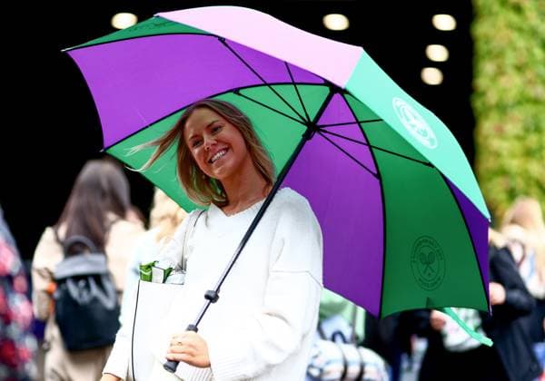 Umbrellas are seen up around centre court as rain falls before the start of play. Wimbledon Tennis Championships, Day 7, The All England Lawn Tennis and Croquet Club, London, UK - 07 Jul 2024  Copyright: xJamesxMarsh Shutterstockx 14575060a