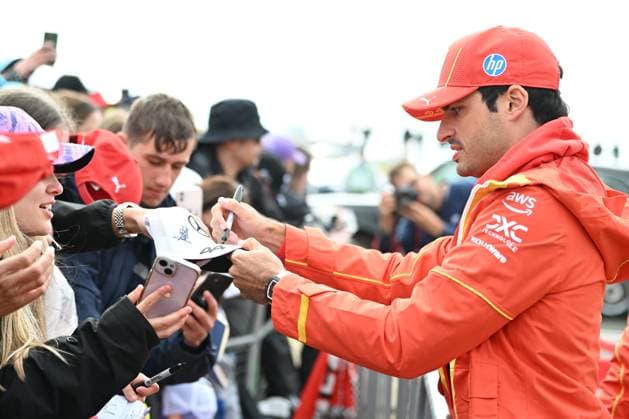 7th July 2024; Silverstone Circuit, Northamptonshire, England: Formula 1 2024 Qatar Airways British F1 Grand Prix; Race Day: Carlos Sainz Jr. (55) of Ferrari signs autographs as he arrives at the Silverstone paddock  ActionPlus12665521 SimonxWest