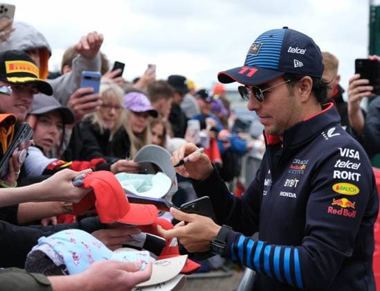 7th July 2024; Silverstone Circuit, Northamptonshire, England; Formula 1 2024 Qatar Airways British F1 Grand Prix; Race Day; Sergio Perez, Red Bull Racing signs autographs for the fans  ActionPlus12665577 PaulxBonser