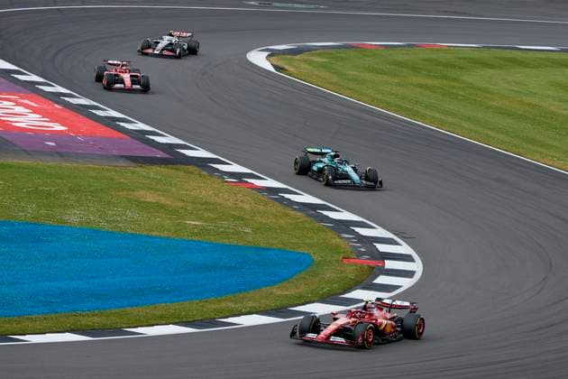 F1 Grand Prix of Great Britain Carlos Sainz of Spain driving the (55) Scuderia Ferrari SF-24 on track and Lance Stroll of Canada driving the (18) Aston Martin Aramco F1 Team AMR24 Mercedes on track during the F1 Grand Prix of Great Britain at Silverstone Circuit on July 7, 2024, in Northampton, England. Northampton Silverstone Circuit Northampton England RL_GPF1GB24_01090 Copyright: xRicardoxLarreinax
