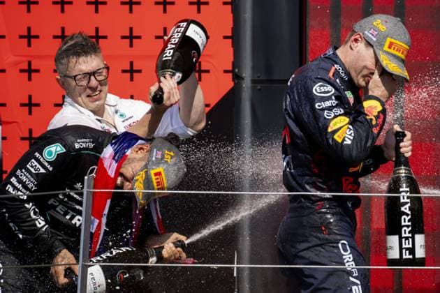 SILVERSTONE - (L-R) Peter Bennington (Mercedes), Lewis Hamilton (Mercedes) and Max Verstappen (Red Bull Racing) on the podium after the British Grand Prix at the Silverstone Circuit. ANP SANDER KONING xVIxANPxSportx xxANPxIVx 502995629 originalFilename: 502995629.jpg