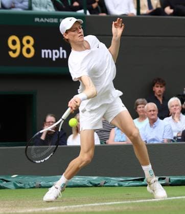 Italy s Jannik Sinner plays a forehand in his match against USA s Ben Shelton on day seven of the 2024 Wimbledon Championships in London on Sunday, July 07, 2024.  LON2024070730 HUGOxPHILPOTT