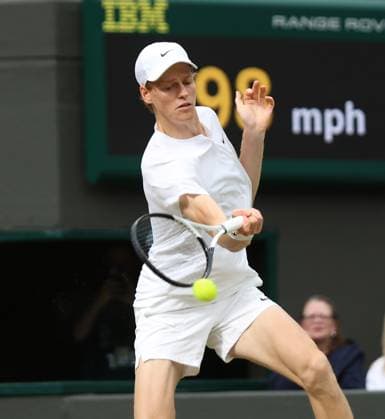 Italy s Jannik Sinner plays a forehand in his match against USA s Ben Shelton on day seven of the 2024 Wimbledon Championships in London on Sunday, July 07, 2024.  LON2024070732 HUGOxPHILPOTT