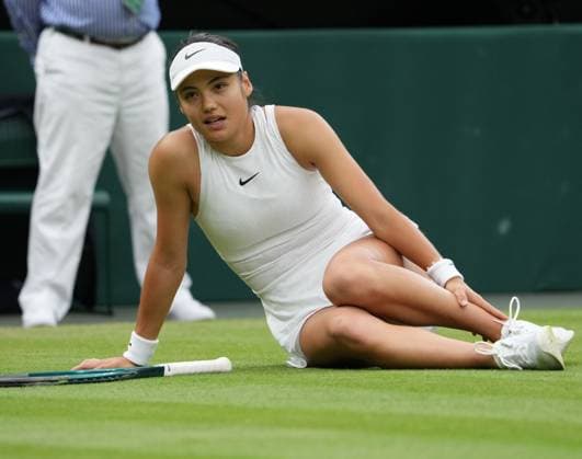 Lawn Tennis - 2024 Wimbledon Championship Womens Singles - Emma Radacanu (GBR) v Lulu Sun (NZL) All England Lawn Tennis & Croquet Club - Sunday 7th July 2024 Emma Radacanu (GBR) slips on the grass which resulted in Medical attention 