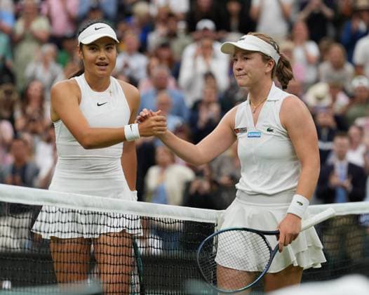 Lawn Tennis - 2024 Wimbledon Championship Womens Singles - Emma Radacanu (GBR) v Lulu Sun (NZL) All England Lawn Tennis & Croquet Club - Sunday 7th July 2024 Emma Radacanu congratulates Lulu Sun at the net 
