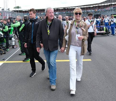 7th July 2024; Silverstone Circuit, Northamptonshire, England; Formula 1 2024 Qatar Airways British F1 Grand Prix; Race Day; Jeremy Clarkson and his partner Lisa Hogan walking down the grid  ActionPlus12666148 PaulxBonser
