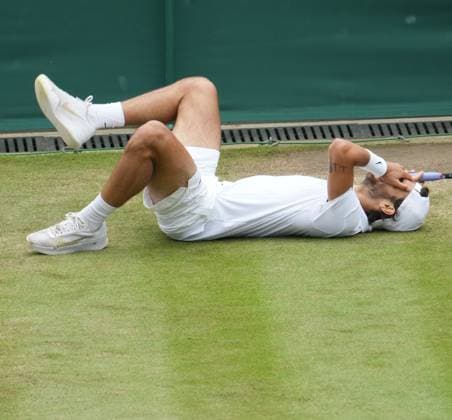 Lawn Tennis - 2024 Wimbledon Championship Lorenzo Musetti (ITA) v Giovanni Mpetshi Perricard (FRA) All England Lawn Tennis & Croquet Club - Monday 8th July 2024 Lorenzo Musetti (ITA) drops to the ground as he wins the match 