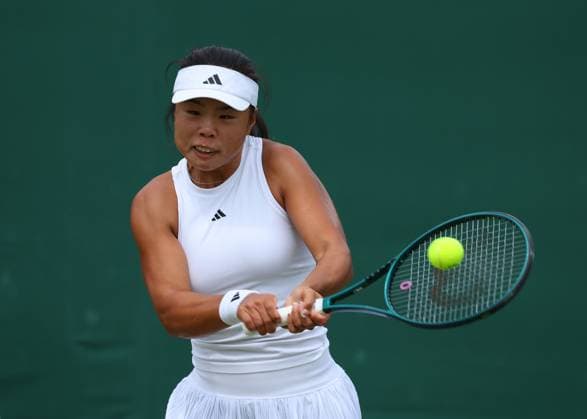 8th July 2024; All England Lawn Tennis and Croquet Club, London, England; Wimbledon Tennis Tournament, Day 8; Mingge Xu (GBR) with a backhand shot to Joy De Zeeuw (NED) in their womens singles match  ActionPlus12666221 JohnxPatrickxFletcher