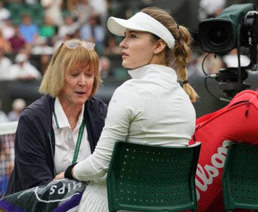 Lawn Tennis - 2024 Wimbledon Championship Ladies Singles - Elena Rybakina (KAZ) v Anna Kalinskaya All England Lawn Tennis & Croquet Club - Monday 8th July 2024 Anna Kalinskaya receives attention for an arm injury 