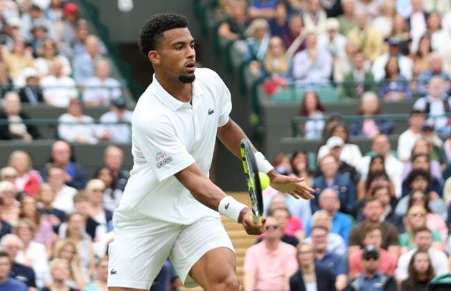 France s Arthur Fils plays a forehand in his fourth round match against Australian Alex De Minaur at the 2024 Wimbledon Championships in London on Monday, July 08, 2024.  LON2024070811 HUGOxPHILPOTT