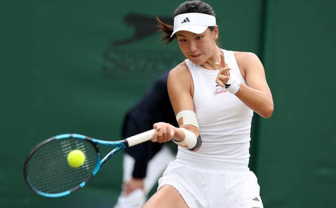 (240708) -- LONDON, July 8, 2024 -- Wang Xinyu of China hits a return during the women s singles 4th round match between Elina Svitolina of Ukraine and Wang Xinyu of China at Wimbledon tennis Championship in London, Britain, on July 8, 2024. ) (SP)BRITAIN-LONDON-TENNIS-WIMBLEDON-DAY 8 LixYing 