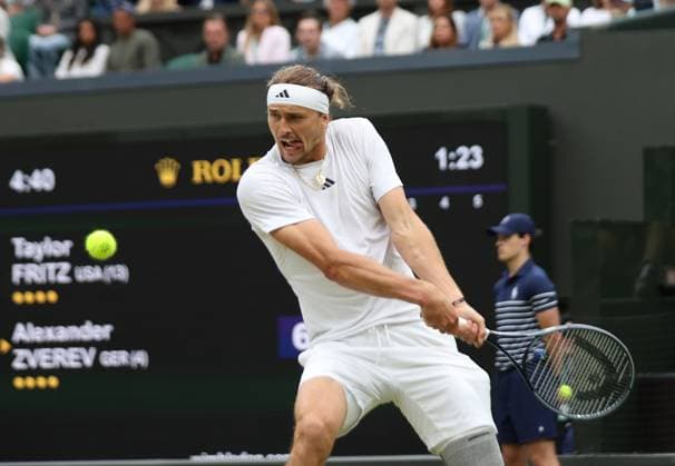 Germany s Alexander Zverev plays a backhand in his fourth round match against USA s Taylor Fritz at the 2024 Wimbledon Championships in London on Monday, July 08, 2024.  LON2024070830 HUGOxPHILPOTT