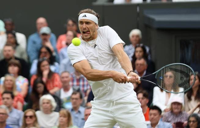 Germany s Alexander Zverev plays a backhand in his fourth round match against USA s Taylor Fritz at the 2024 Wimbledon Championships in London on Monday, July 08, 2024.  LON2024070840 HUGOxPHILPOTT