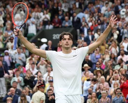 USA s Taylor Fritz celebrates victory in his fourth round match against Germany s Alexander Zverev at the 2024 Wimbledon Championships in London on Monday, July 08, 2024.  LON2024070880 HUGOxPHILPOTT