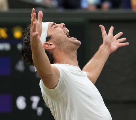 Lawn Tennis - 2024 Wimbledon Championship Mens Singles - Taylor Fritz (USA) v Alexander Zverev (GER) All England Lawn Tennis & Croquet Club - Monday 8th July 2024 Taylor Fritz (USA) celebrates winning match point 