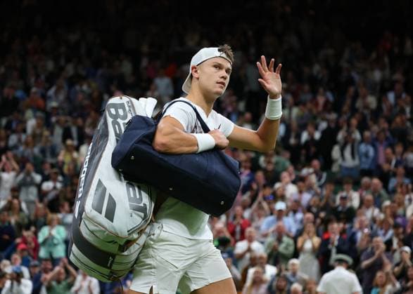 8th July 2024; All England Lawn Tennis and Croquet Club, London, England; Wimbledon Tennis Tournament, Day 8; Holger Rune (DEN) waves to the spectators after losing to Novak Djokovic (SRB) by straight sets in his mens singles match  ActionPlus12666332 JohnxPatrickxFletcher