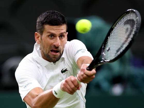 (240709) -- LONDON, July 9, 2024 -- Novak Djokovic hits a return during the men s singles 4th round match between Novak Djokovic of Serbia and Holger Rune of Denmark at Wimbledon tennis Championship in London, Britain, on July 8, 2024. ) (SP) BRITAIN-LONDON-TENNIS-WIMBLEDON-DAY 8 LixYing 