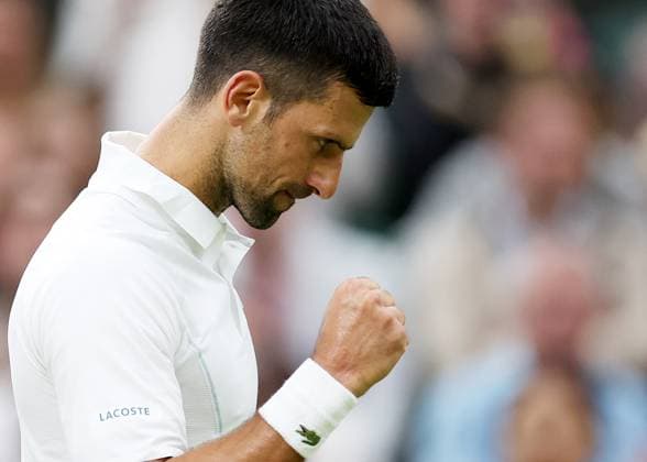 (240709) -- LONDON, July 9, 2024 -- Novak Djokovic celebrates scoring during the men s singles 4th round match between Novak Djokovic of Serbia and Holger Rune of Denmark at Wimbledon tennis Championship in London, Britain, on July 8, 2024. ) (SP) BRITAIN-LONDON-TENNIS-WIMBLEDON-DAY 8 LixYing 