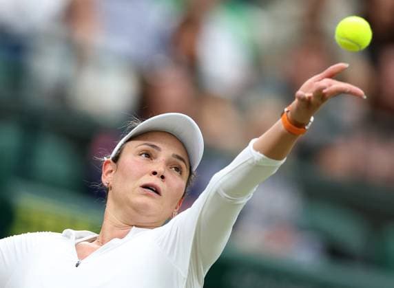 (240709) -- LONDON, July 9, 2024 -- Donna Vekic serves during the women s singles quarterfinal match between Sun Lulu of New Zealand and Donna Vekic of Croatia at Wimbledon tennis Championship in London, Britain, July 9, 2024. ) (SP)BRITAIN-LONDON-TENNIS-WIMBLEDON-DAY 9 LixYing 