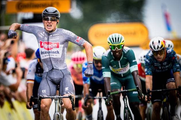 Belgian Jasper Philipsen of Alpecin-Deceuninck celebrates as he crosses the finish line to win stage 10 of the 2024 Tour de France cycling race, from Orleans to Saint-Amand-Montrond, France (187,3 km) on Tuesday 09 July 2024. The 111th edition of the Tour de France starts on Saturday 29 June and will finish in Nice, France on 21 July. JASPERxJACOBS  x96144941x