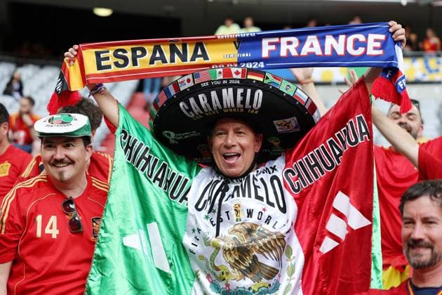 Munich, Germany, 9th July 2024. Spanish fans arrive at the stadium prior to the UEFA European Championships semi final match at Allianz Arena, Munich. Picture credit should read: Paul Terry Sportimage EDITORIAL USE ONLY. No use with unauthorised audio, video, data, fixture lists, club league logos or live services. Online in-match use limited to 120 images, no video emulation. No use in betting, games or single club league player publications. SPI-3225-0012