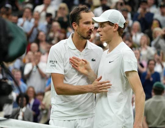 Lawn Tennis - 2024 Wimbledon Championship Jannick Sinner (ITA) v Daniil Medvedev All England Lawn Tennis & Croquet Club - Tuesday 9h July 2024 Daniil Medvedev consoles Sinner at the net after the match 