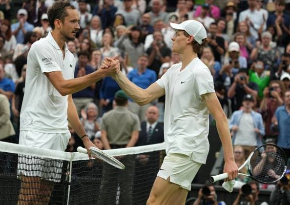 Lawn Tennis - 2024 Wimbledon Championship Jannick Sinner (ITA) v Daniil Medvedev All England Lawn Tennis & Croquet Club - Tuesday 9h July 2024 Daniil Medvedev consoles Sinner at the net after the match 