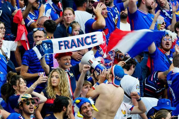 Supporters of France enjoy the pre-match atmosphere from the stands with flags and banners Spain v France, UEFA European Championship, EM, Europameisterschaft 2024, Semi Final, Football, Munich Football Arena, Munich, Germany - 09 Jul 2024 EDITORIAL USE ONLY No use with unauthorised audio, video, data, fixture lists, club league logos or live services. Online in-match use limited to 120 images, no video emulation. No use in betting, games or single club league player publications. Copyright: xDavexShopland Shutterstockx 14576888l