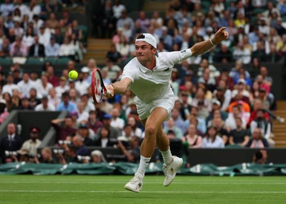 9th July 2024; All England Lawn Tennis and Croquet Club, London, England; Wimbledon Tennis Tournament, Day 9; Tommy Paul (USA) at the net against Carlos Alcaraz (ESP), mens singles quarter final match  ActionPlus12666417 JohnxPatrickxFletcher