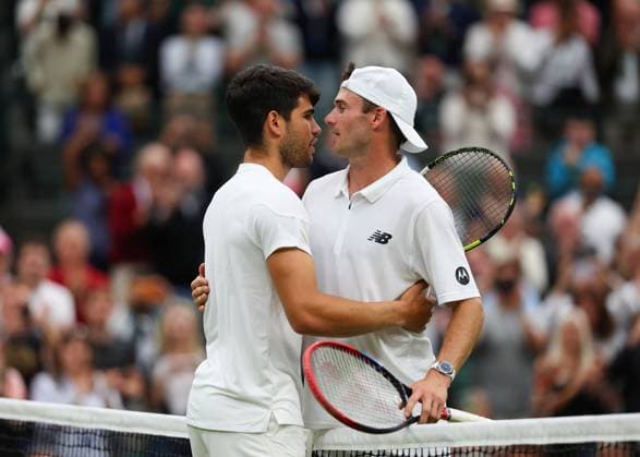 9th July 2024; All England Lawn Tennis and Croquet Club, London, England; Wimbledon Tennis Tournament, Day 9; Defending Champion Carlos Alcaraz (ESP) is congratulated by Tommy Paul (USA) and reaches the mens singles semi finals  ActionPlus12666424 JohnxPatrickxFletcher