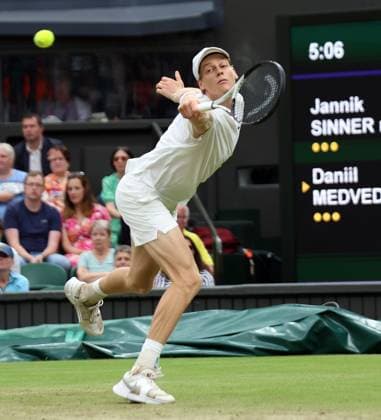Italy s Jannik Sinner plays a backhand in his Men s Quarter-Final match against Daniil Medvedev at the 2024 Wimbledon Championships in London on Tuesday, July 09, 2024.  LON2024070936 HUGOxPHILPOTT