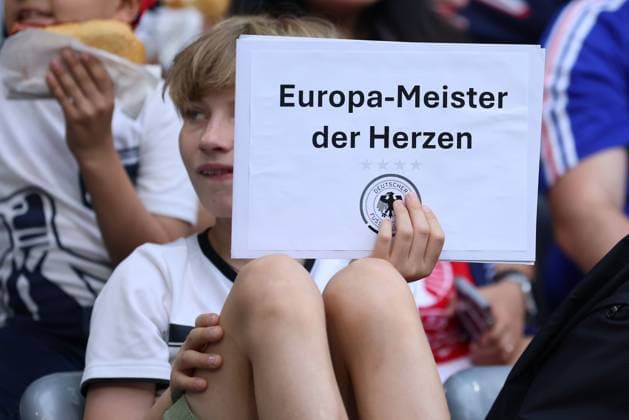 Soccer UEFA EURO 2024 Semi Final Spain France on 09 07 2024 at the Munich Football Arena in Munich Fan Germany shows a sign with the inscription Europe Champion of Hearts xMSx