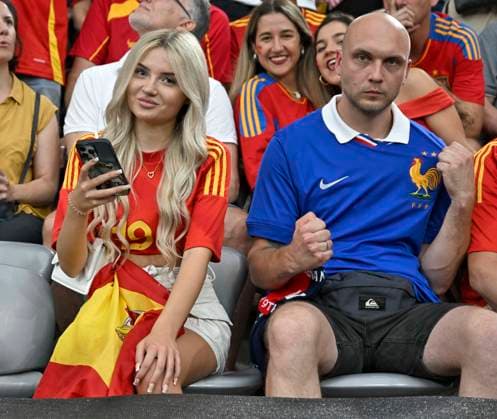 09 07 2024, Football UEFA EURO 2024, Semi-final, Spain France, in the Munich Football Arena Spanish woman sitting next to Frenchmen