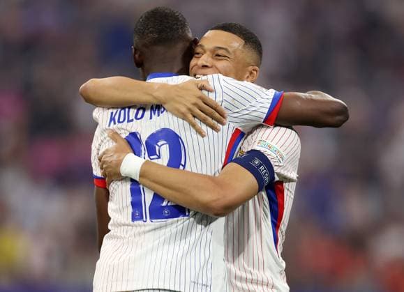 Munich, Germany, 9th July 2024. Randal Kolo Muani of France (L) celebrates after scoring the opening goal with Kylan Mbappe of France during the UEFA European Championships semi final match at Allianz Arena, Munich. Picture credit should read: Paul Terry Sportimage EDITORIAL USE ONLY. No use with unauthorised audio, video, data, fixture lists, club league logos or live services. Online in-match use limited to 120 images, no video emulation. No use in betting, games or single club league player publications. SPI-3225-0046