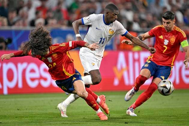 09 07 2024, Football UEFA EURO 2024, Semi-final, Spain France, at the Munich Football Arena Marc Cucurella Spain brings down Ousmane Dembele France