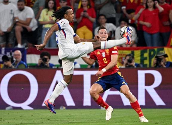 Russia Soccer Euro 2024 Spain - France 8726067 09.07.2024 France s Jules Kounde and Spain s Fabian Ruiz struggle for the ball during the UEFA EURO, EM, Europameisterschaft,Fussball 2024 semi-final soccer match between Spain and France at the Munich Football Arena in Munich, Germany. Alexey Filippov Sputnik Munich Germany  Copyright: xAlexeyxFilippovx